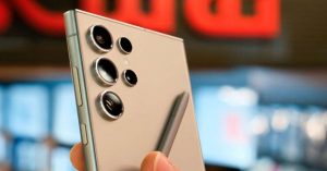 Close-up of a Samsung Galaxy S23 Ultra with triple rear cameras and an S Pen.