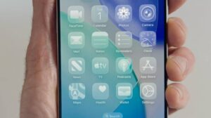 Close-up of iPhone home screen with iOS 26 interface