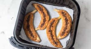 Baked bananas with cinnamon and chocolate chips in air fryer.