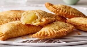 Golden crispy apple turnovers with sweet apple filling.