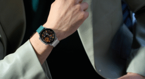 Person wearing round smartwatch with dual-tone strap and digital display