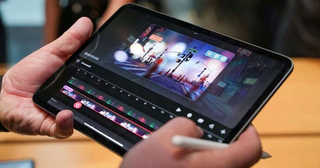 Editing video on tablet with stylus in hand