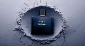Bleu de Chanel perfume bottle on cracked textured blue background