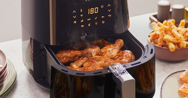 Chicken drumsticks cooking in Philips air fryer at 180 degrees
