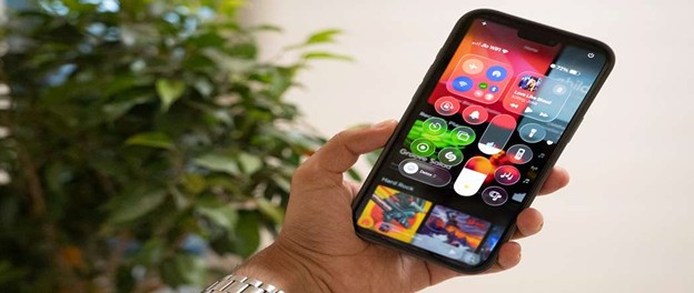 iPhone screen showing iOS 26 control center in dark mode