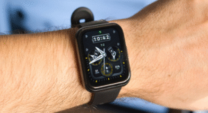 Smartwatch with analog-style face on man's wrist