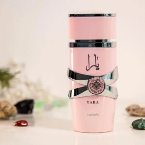 Yara pink perfume bottle by Lattafa with elegant silver accents on soft background. 