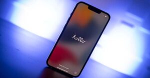 iPhone screen displaying "Hello" during initial setup phase.
