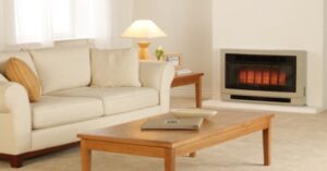 Gas heater warming a cozy living room with sofa and coffee table.