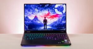 Laptop displaying a fantasy scene with colorful RGB keyboard and glowing lights.