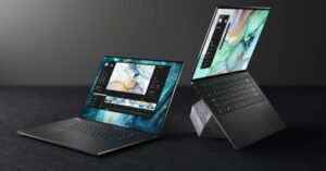 Two premium laptops running video editing and graphic design software.