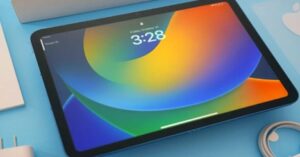 Close-up of a blue iPad showing the lock screen with a colorful background.