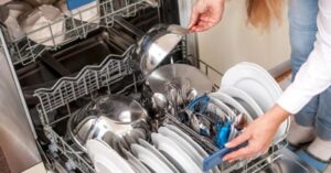 Incorrectly arranged dishes inside a dishwasher reducing cleaning efficiency