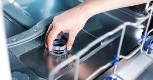 Removing and cleaning the dishwasher filter to improve washing performance