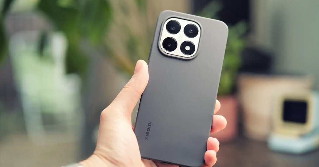 Xiaomi smartphone with quad camera held in hand