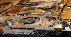 dusty laptop fan causing overheating and slow performance due to poor cooling system