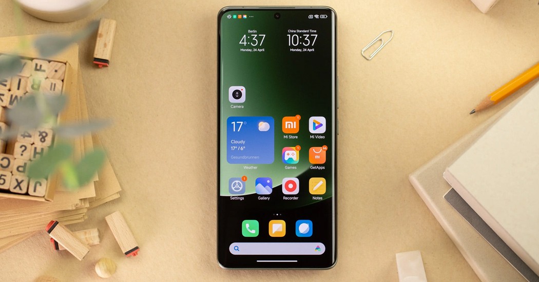Xiaomi smartphone home screen on a desk