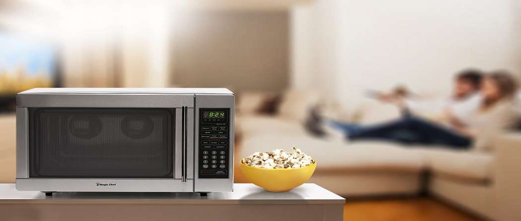 Microwave oven with popcorn bowl in living room setting