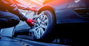 wheel alignment service adjusting car tire to prevent uneven wear and extend tire lifespan
