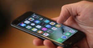 hand using smartphone with multiple apps open representing mobile performance and app usage