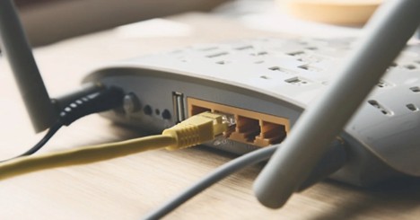 Wireless router with Ethernet cable connected to LAN port
