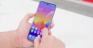 hand using smartphone with multiple apps on home screen representing mobile usage and performance optimization
