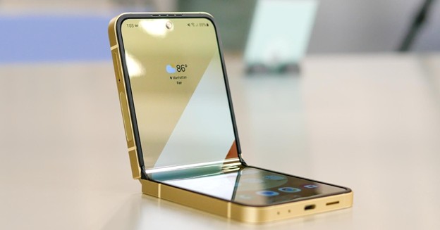 Samsung Galaxy Z foldable smartphone partially open on a table