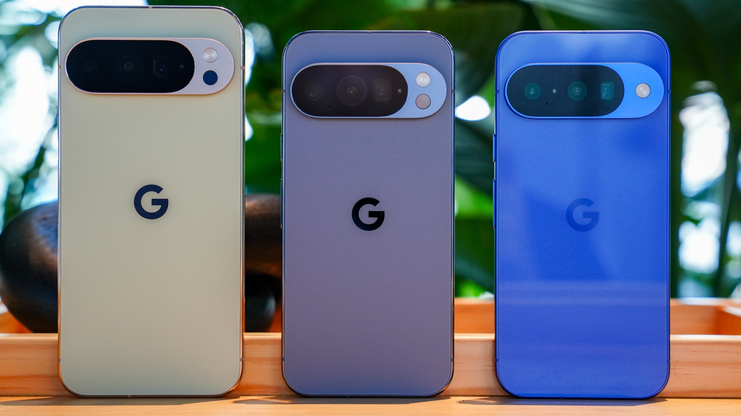 Google Pixel 10 Pro, Pixel 10 and Pixel 10a smartphones shown side by side in different colors with rear camera designs on display. 