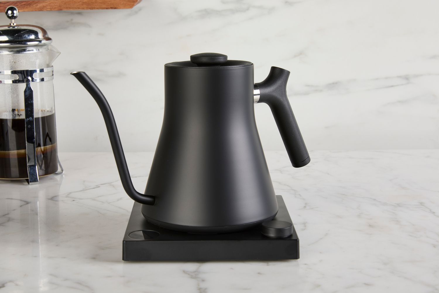 

**Stainless steel electric kettle with gooseneck spout on a modern kitchen countertop**
