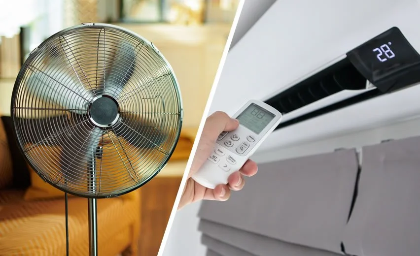 Standing fan beside a wall-mounted air conditioner controlled with a remote