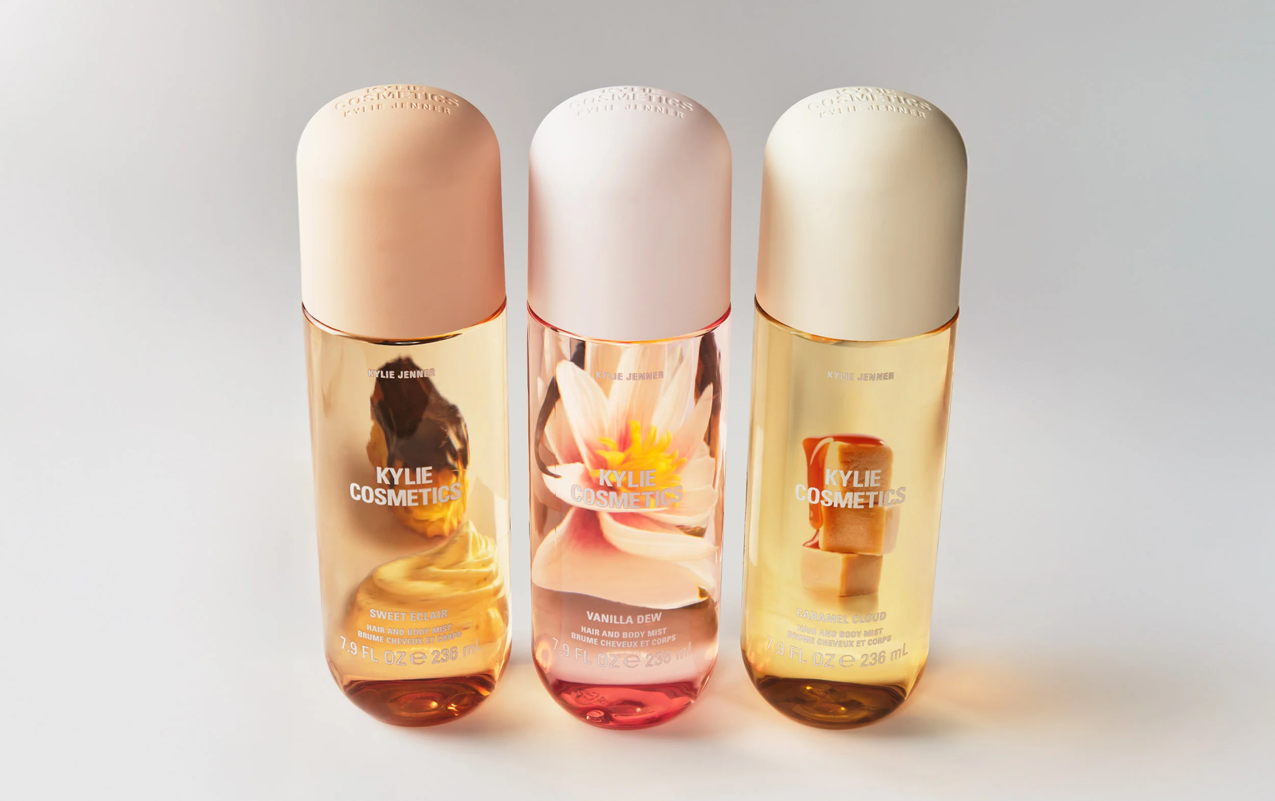 Three body mist bottles displayed together on a clean background for fragrance comparison