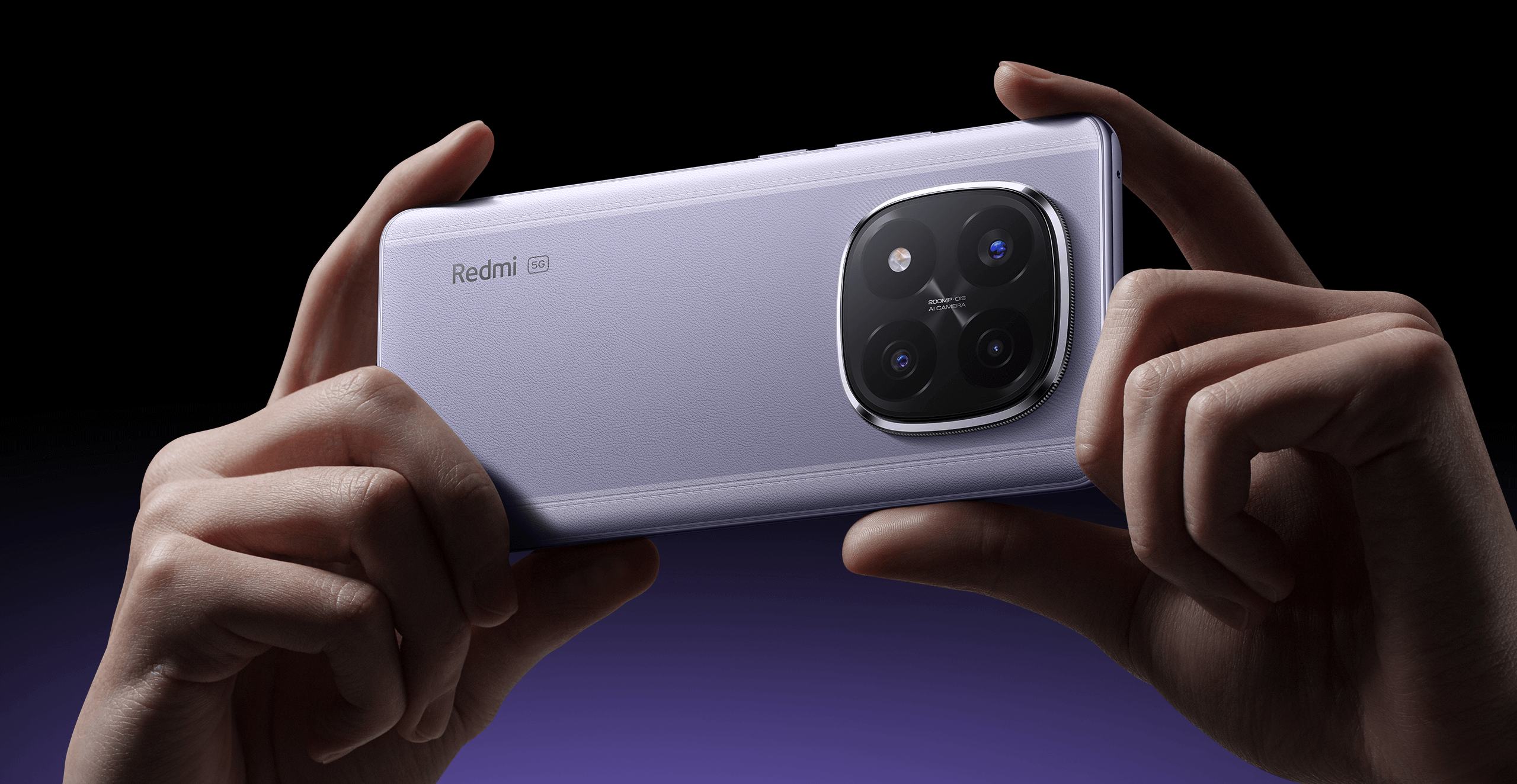 Hands holding a purple Redmi smartphone horizontally, showing its large rear camera module.
