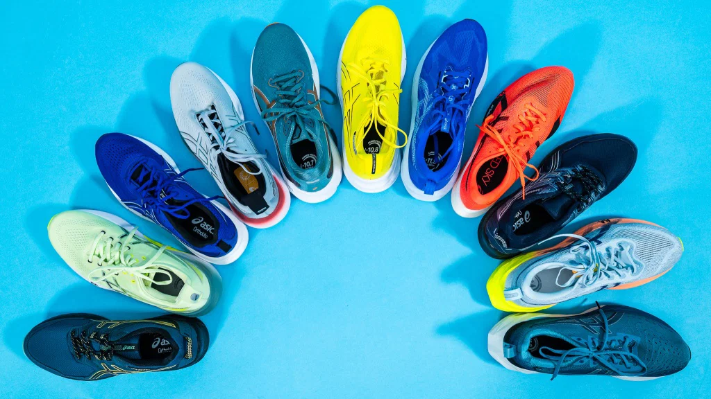 
Colorful running shoes arranged in a circle on a blue background.
