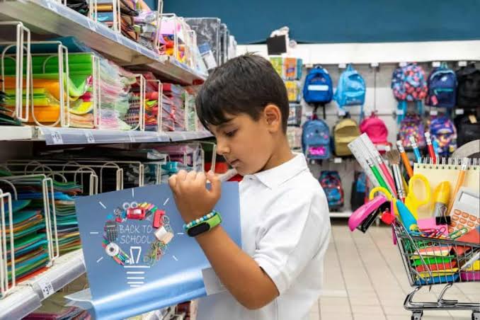 Boy choosing school supplies in a stationery store