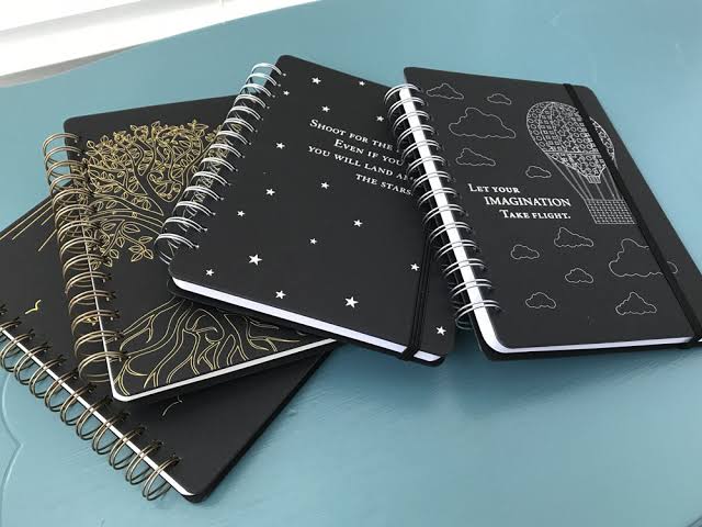 Black spiral notebooks with decorative covers