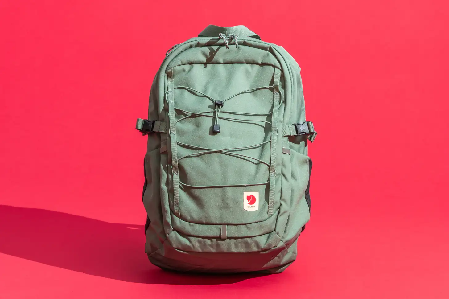 Green university backpack with multiple compartments and adjustable straps