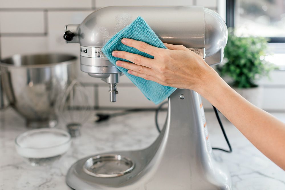 Cleaning a stand mixer with a microfiber cloth