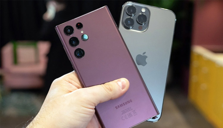 Samsung Galaxy and iPhone held side by side showing rear camera systems