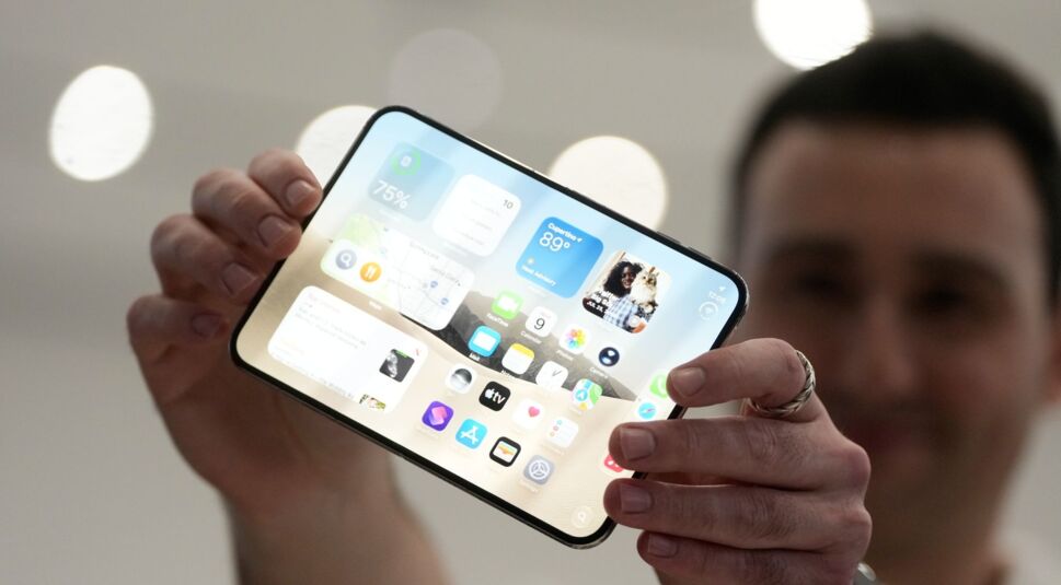 Foldable iPhone concept held in landscape mode with iOS interface