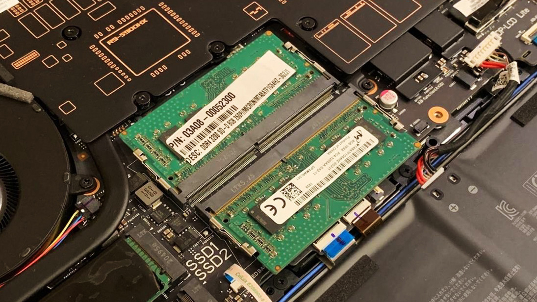 Laptop RAM modules installed on motherboard inside an open laptop