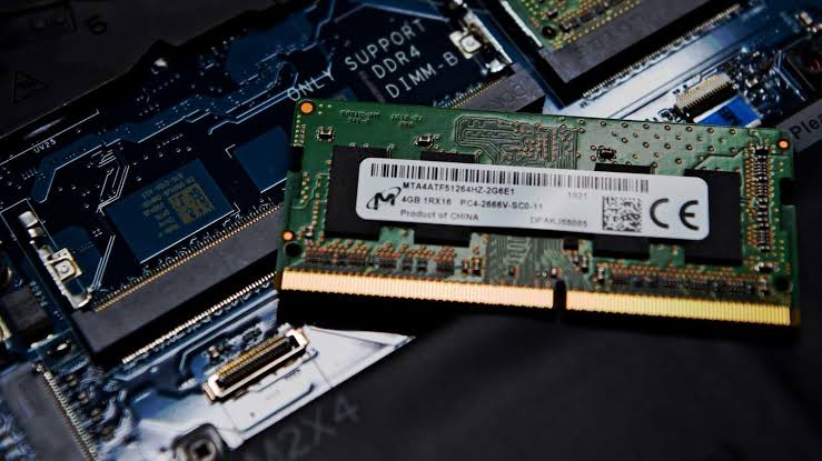 Laptop RAM module installed near motherboard memory slots