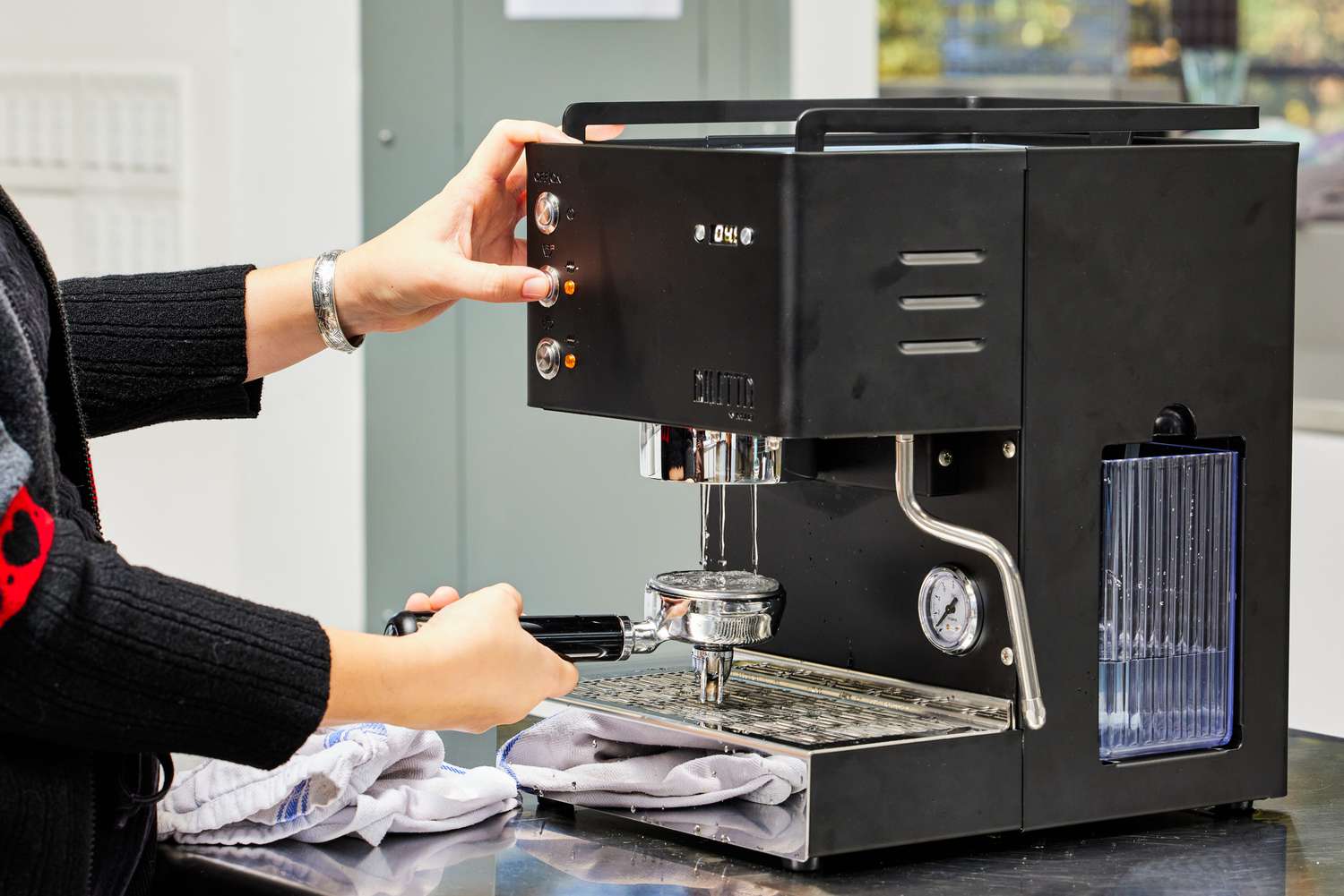 Cleaning an espresso machine and portafilter during routine maintenance