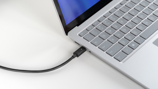 USB-C charging cable connected to a laptop for proper battery charging