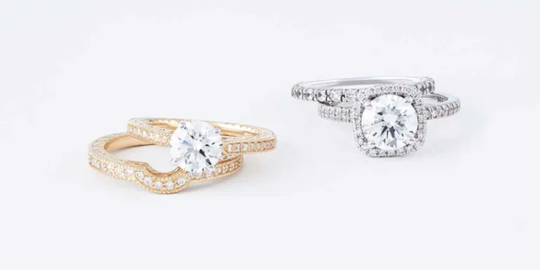 Yellow gold and white gold diamond rings displayed side by side