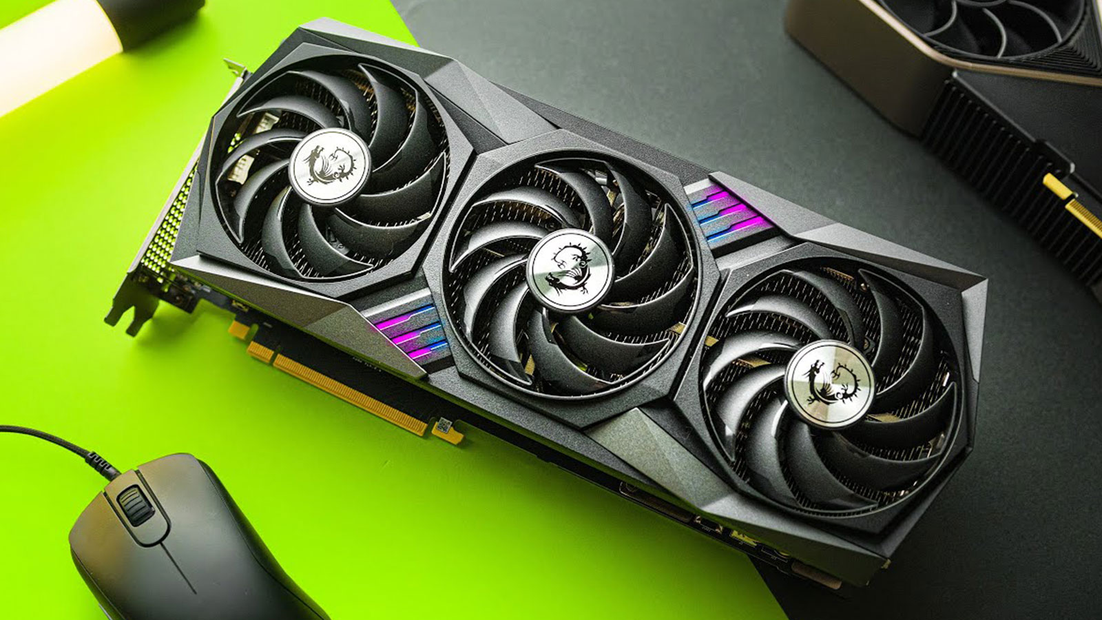 MSI triple-fan graphics card on a green gaming setup