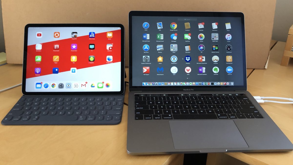 iPad with keyboard and MacBook Pro displayed side by side
